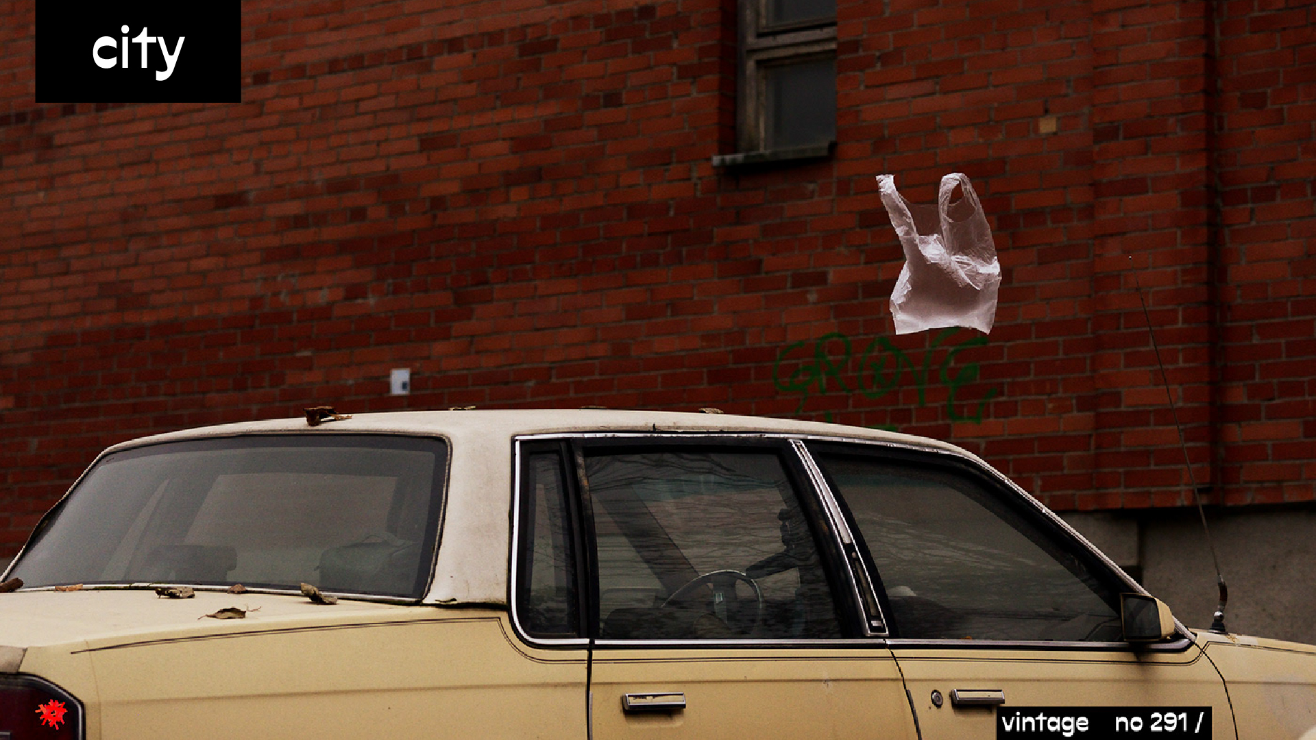 365 UTOPIA city visual featuring a plastic bag above a vintage car